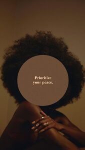 Young Black woman with a natural afro, sitting quietly in prayer and searching for peace, symbolizing faith, reflection, and finding calm through God.