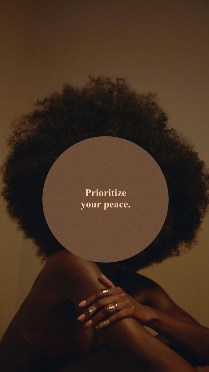 Young Black woman with a natural afro, sitting quietly in prayer and searching for peace, symbolizing faith, reflection, and finding calm through God.